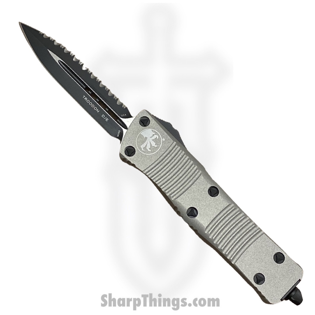398480ca-2d2c-46fd-881e-f1aab993ce79_138-3TG_1.jpg Microtech - 138-3TG - NOS - Combat Troodon - OTF Auto - M390 Coated Dagger - 6061-T6 Aluminum - Gray - Image 1